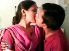 couple smooching and friend recorded